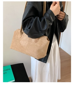 Detail of camel suede tote bag showing soft texture and rectangle minimalist design