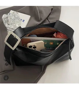 Top view showing the spacious interior and silver buckle of this large black tote bag