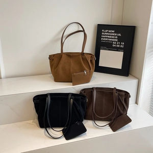 Three suede tote bags in brown, black, and dark coffee colors with matching small pouches