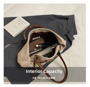 Detail of khaki tote interior with magnetic buckle and spacious storage compartment