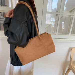 Vintage caramel oversized faux suede tote bag for women showing crossbody underarm wear