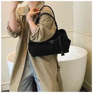 Detail of black leopard jacquard tote bag with leather handles and silver buckle detail