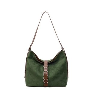 Green suede hobo tote bag with brown leather straps and silver buckle on white background