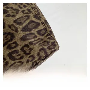 Macro detail of leopard print tote bag showing premium suede texture and stitching