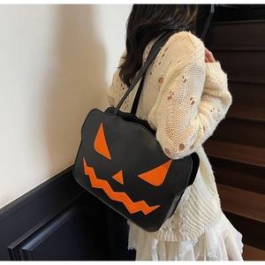 Detail view of the Halloween pumpkin tote bag in black PU leather with orange patches