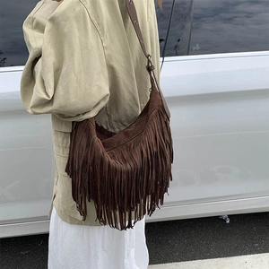 Bohemian brown suede shoulder bag featuring long fringe tassels and retro leather strap