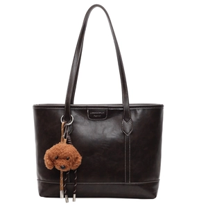 Dark brown tote bag with contrast stitching and teddy charm on a white background