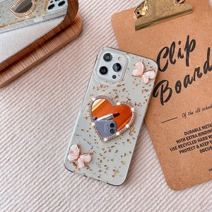 Custodia iPhone trasparente con foglia d'oro, farfalle 3D e specchio a cuore strass