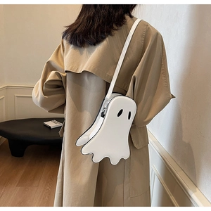 Ghost-shaped white crossbody bag styled with a trench coat for a casual Halloween look