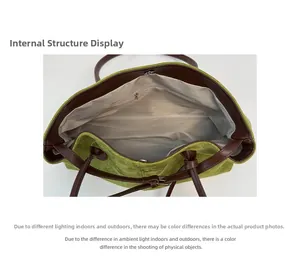 Macro shot of large green tote bag interior featuring zipper pocket and magnetic closure