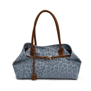 Blue leopard print tote bag with brown handles and gold hardware in high capacity