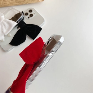 Detail shot of the plush velvet bow and precise side cutouts on this iPhone case