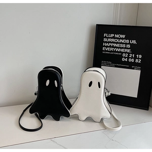 Detailed view of the cute ghost cross-body bags in black and white PU leather