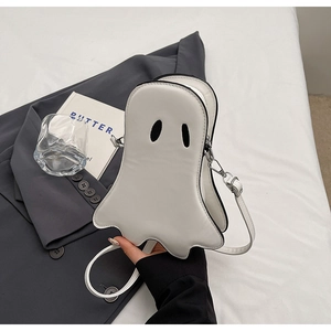 Close-up of white PU leather ghost crossbody bag with black eyes for Halloween