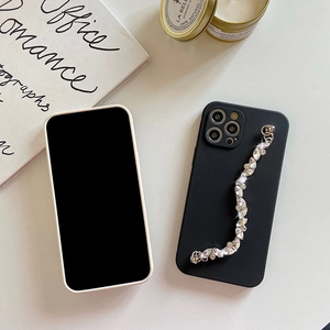 Detail of black matte iPhone case featuring a sparkling marquise rhinestone chain strap