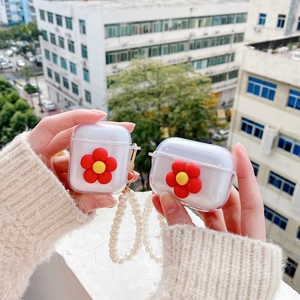 Transparent AirPods case with red sun flower and elegant pearl wrist strap keychain