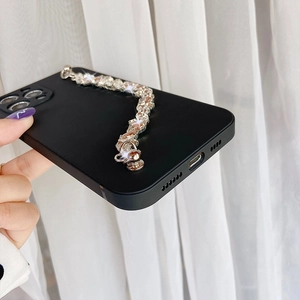 Black matte iPhone case featuring a luxurious rhinestone chain link strap detail