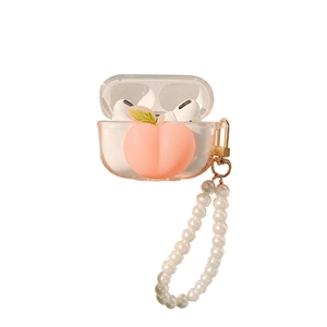 Close-up of clear AirPods Pro case with 3D peach charm and elegant pearl lanyard