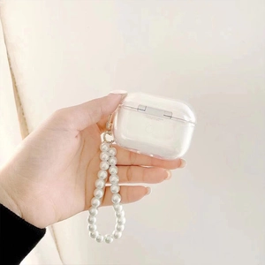 Detail of transparent AirPods Pro case with elegant pearl lanyard and gold metal hook