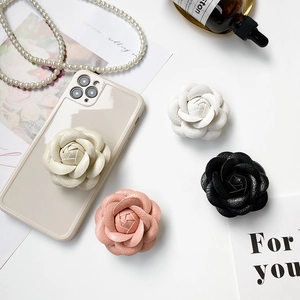Close-up of camellia air bag phone stands in four colors with luxury leather texture