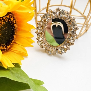 Foldable rhinestone mirror phone socket with golden metal base and sunflower background