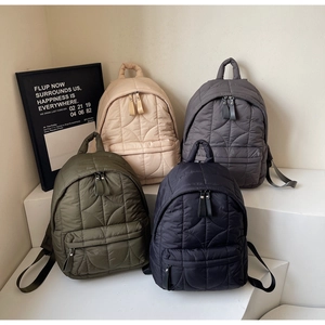 Quilted nylon backpack group showing dark green, apricot, grey and black color options