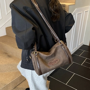 Vintage dark brown Boston shoulder bag with matte finish and elegant gold hardware