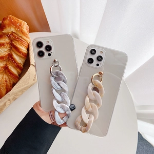 Close-up of marble texture resin chain strap on a clear protective phone case