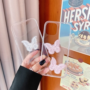 Detail of transparent iPhone case featuring 3D lace butterfly embroidery in white and pink