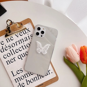 Detail of white lace butterfly embroidery on a clear iPhone case with tulip decor