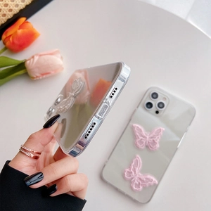 Clear iPhone case featuring 3D pink lace butterflies and premium acrylic finish