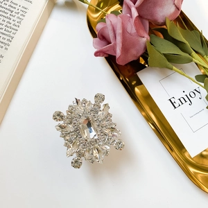 Macro view of crystal rhinestone foldable phone stand with elegant geometric gem layout