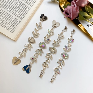 Set of four shimmering rhinestone DIY bracelet chains with colorful teardrop pendants