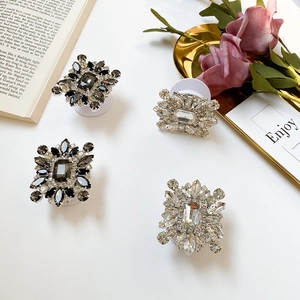 Detail of sparkling rhinestone phone sockets with clear and smoky crystals on desk