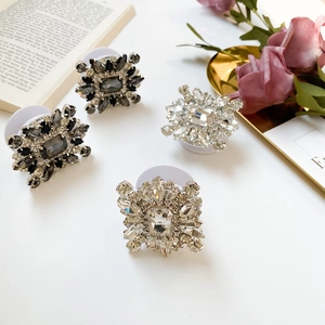 Detail of luxury rhinestone phone sockets with sparkling crystals and foldable design