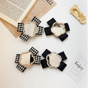 Cute bow phone stand with silver mirror flower and sparkling rhinestone accents