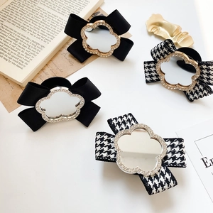 Bow tie phone grip stand with vintage rhinestones and houndstooth pattern for tablets