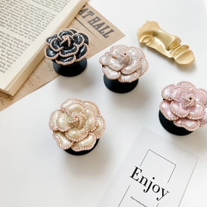 Elegant camellia flower phone socket grip with pearl trim in assorted colors