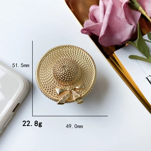Golden straw hat phone socket grip with elegant bowknot and woven texture design