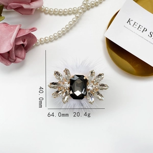 Luxurious flower brooch with black rectangle crystal and soft white faux fur details