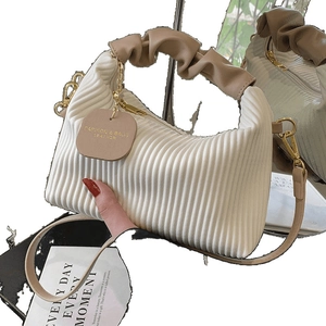 White ruched cloud handbag with khaki gathered handle and gold metal hardware accents