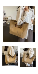 Close-up of a khaki large capacity tote bag with dark brown straps for daily commuting