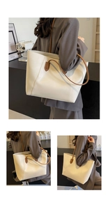 Detailed view of cream tote bag with brown straps featuring a minimalist textured design