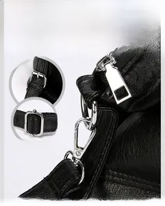 Close-up of premium silver-tone hardware and textured black leather on the shoulder bag