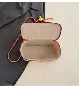 Top view of pink quilted leather bag showing spacious interior and herringbone fabric lining