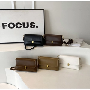 Five minimalist square shoulder bags in neutral tones with woven handles and gold buckles