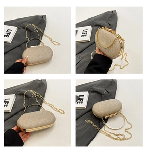 Detail of champagne gold sequin evening clutch with bow clasp and metal chain strap