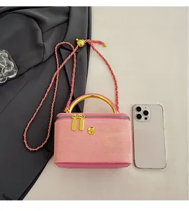 Pink quilted fabric box bag with gold camellia clasp and chain strap for women