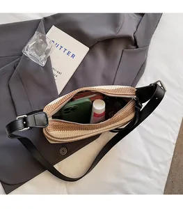 Top view of striped straw shoulder bag interior showing spacious capacity and zipper detail