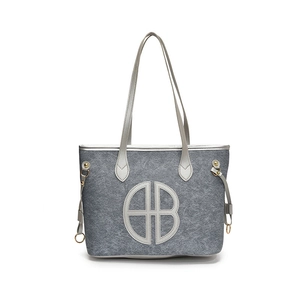 Large grey felt tote bag with leather handles and round logo for daily commuting
